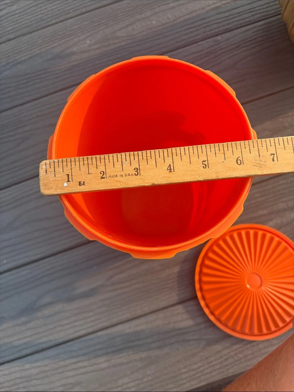 Tupperware Orange Storage Container with Decorative Emblem